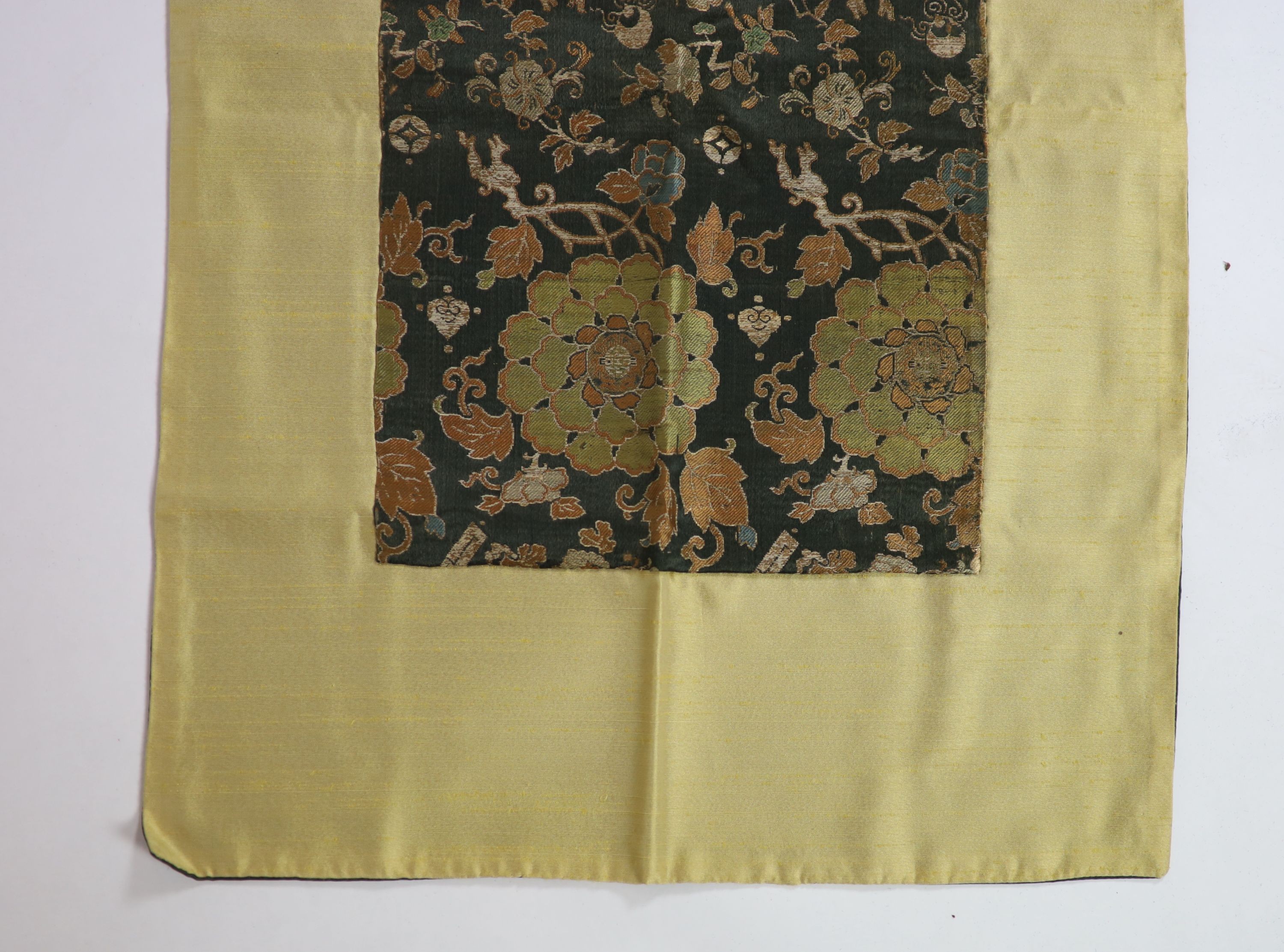 A Chinese brocade panel, 17th/18th century, Total size 169cm x 54cm